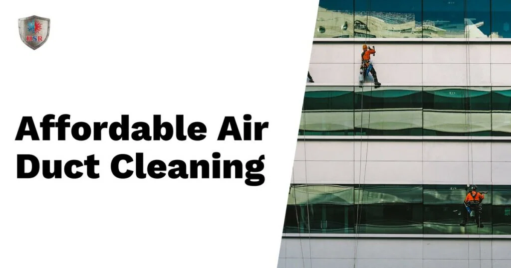 Two workers in safety harnesses clean windows on a modern building; text reads “Affordable Air Duct Cleaning & Dryer Vent Cleaning” on a white background.